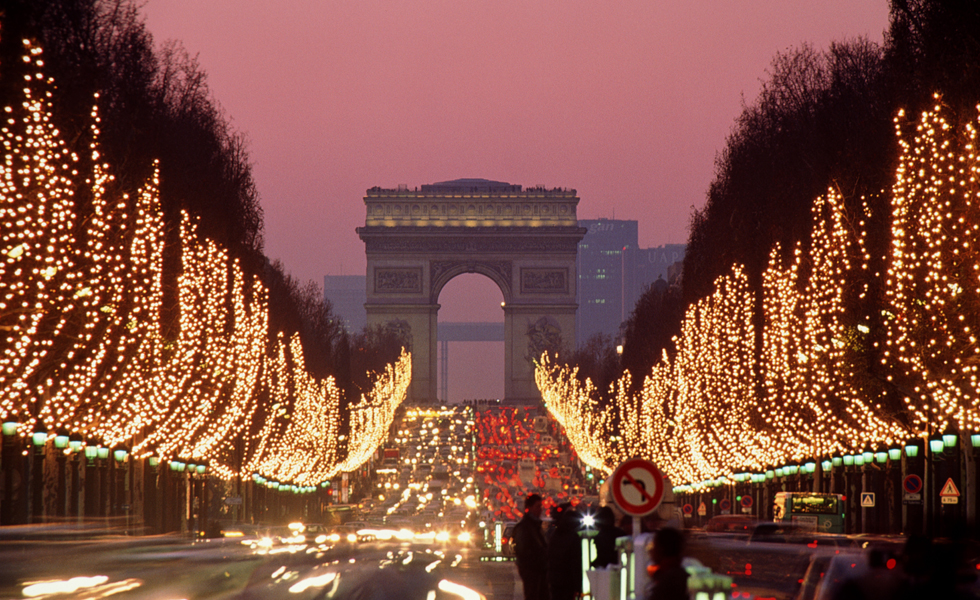France, Paris, Champs-Elysees illuminated at dusk (long exposure)